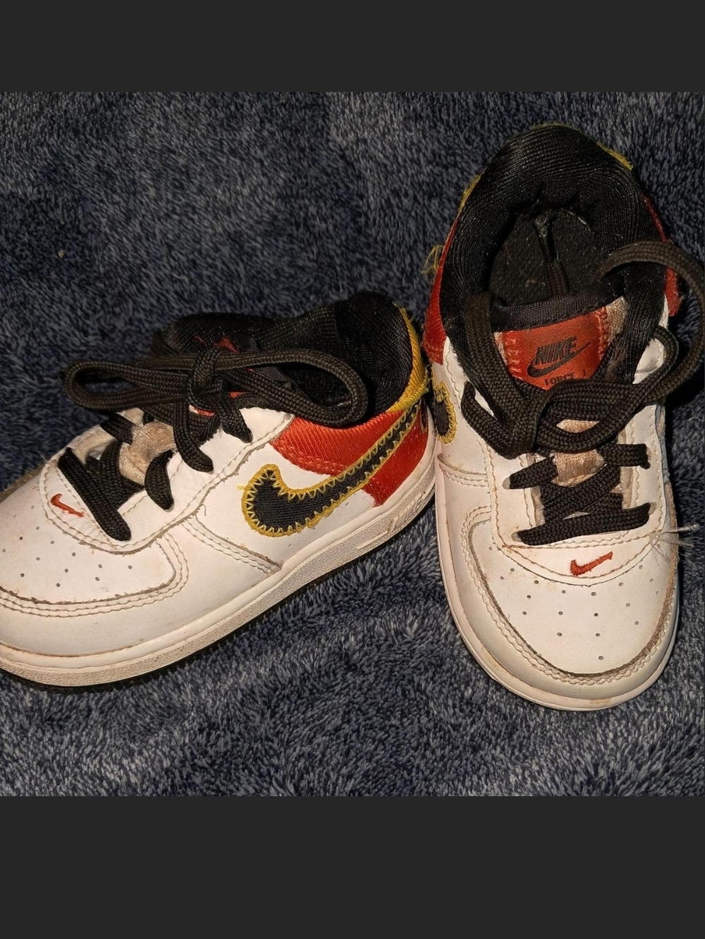 Nike Air Force 1 Kids White Sneakers with Black, Red & Yellow Accents